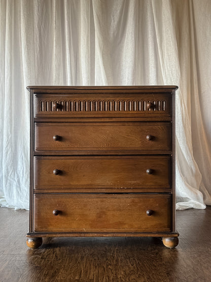 Early 20th Century Four Drawer Oak Chest with Bun Feet