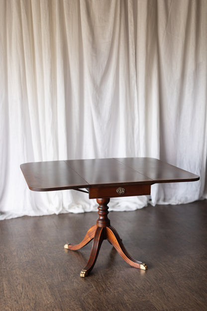 Mahogany Drop-Leaf Pedestal Table with Brass-Capped Feet