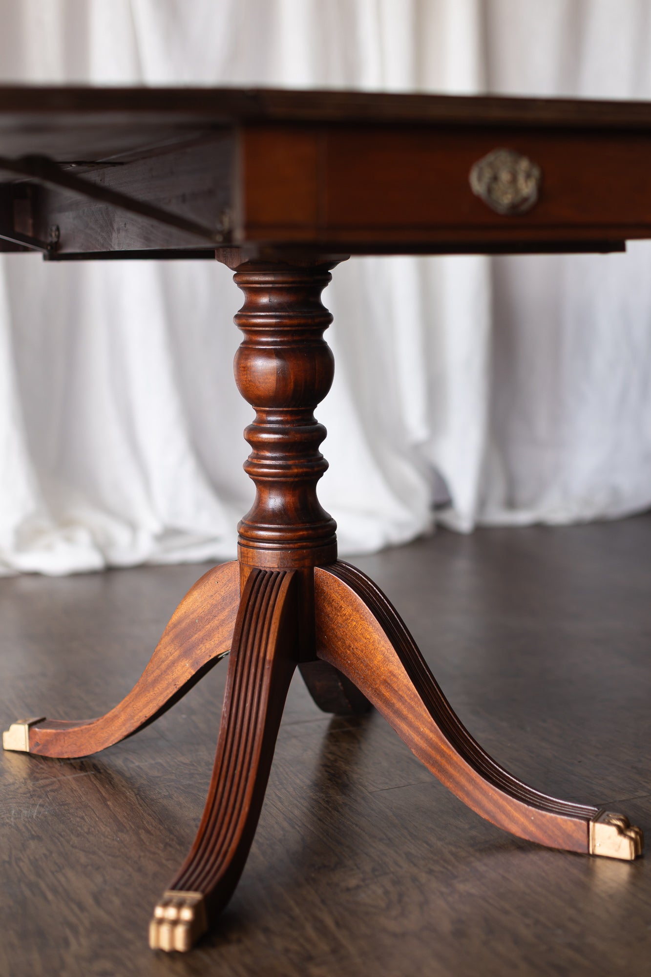 Mahogany Drop-Leaf Pedestal Table with Brass-Capped Feet