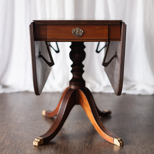 Mahogany Drop-Leaf Pedestal Table with Brass-Capped Feet