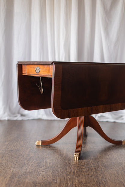 Mahogany Drop-Leaf Pedestal Table with Brass-Capped Feet