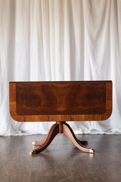 Mahogany Drop-Leaf Pedestal Table with Brass-Capped Feet