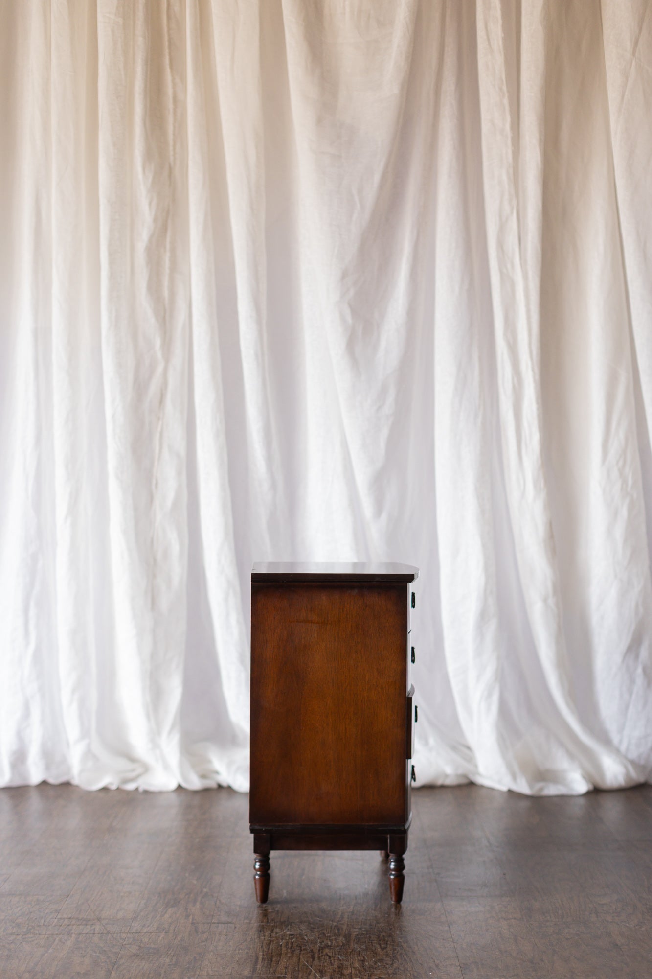 Pair of Four Drawer Nightstands with Turned Feet